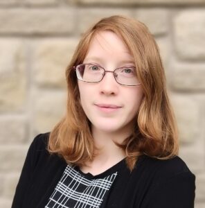 Female attorney reddish brown hair glasses