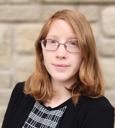 Female attorney reddish brown hair glasses